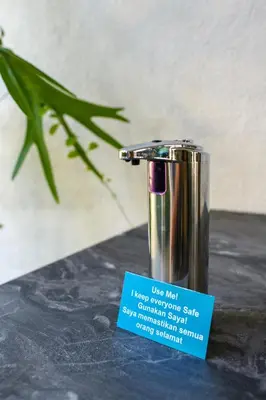 a container sitting on a table with a sign on it at SAVV HOTEL in George Town