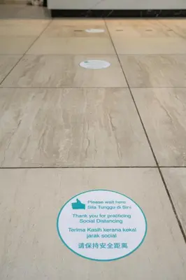 a sign on a tile floor in a building at SAVV HOTEL in George Town