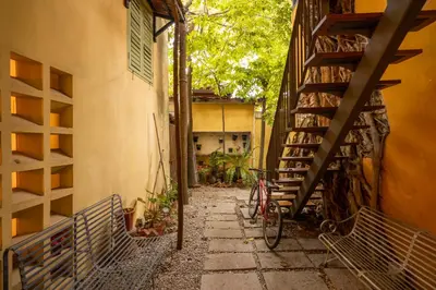 an alley with a bike parked next to a building at Spices Hotel in George Town