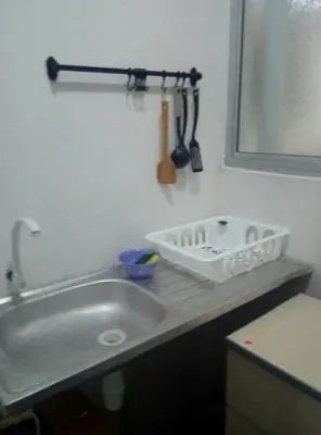 a kitchen counter with a sink and a spatula at MUSLIM 2 BED ROOM APARTMENT GOLDEN HILL in Brinchang