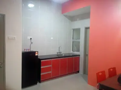 a red and white kitchen with a sink and red cabinets at MUSLIM 2 BED ROOM APARTMENT GOLDEN HILL in Brinchang