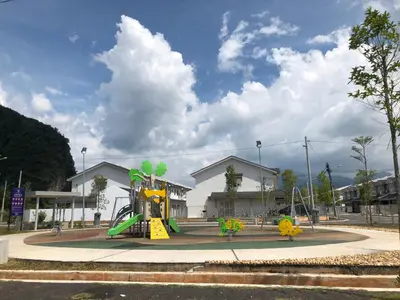 a playground with a slide in front of a building at De Little Cabin - 7mins to Sunway Iost World of Tambun in Ipoh