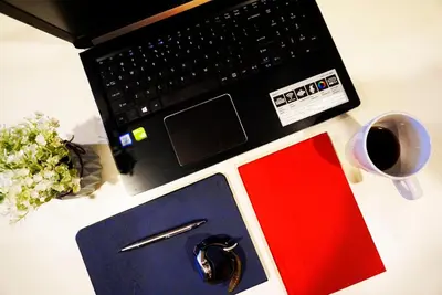 a desk with a laptop computer and a cup of coffee at Excellent Location Octagon Studio at Palo 101 Ipoh in Ipoh