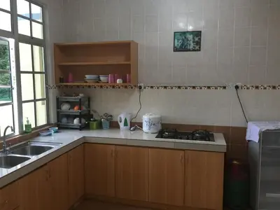 a kitchen with a sink and a stove in it at Cameron Supersave Apartment @ Crown Imperial Court in Brinchang