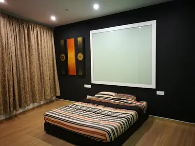 a bed in a room with a large window at Selamat Datang @ 118 Island Plaza Superior Suite in Tanjong Tokong