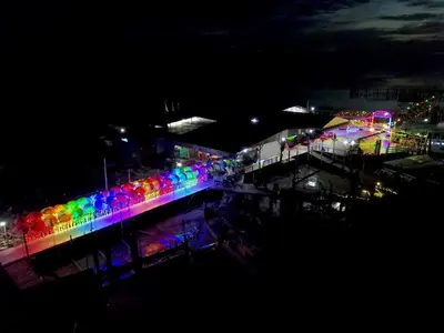 a brightly lit building with a rainbow lit up at night at Hutan Melintang Homestay 12Pax Walk to 7Eleven KFC by willson in Hutan Melintang