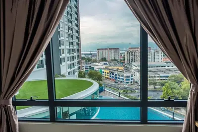 a window view of a city from a hotel room at Woodsbury Suites 7722 Butterworth Penang in Butterworth
