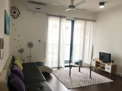 a living room with a couch and a table at Woodsbury Suites 7722 Butterworth Penang in Butterworth