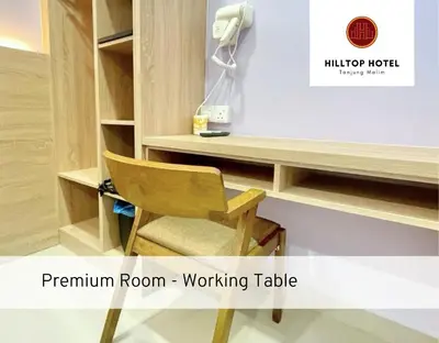 a room with a desk and a chair at Hilltop Hotel Tanjung Malim in Tanjung Malim