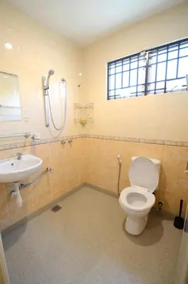a bathroom with a toilet and a sink at Decozy 3.0 Semi-D in Ipoh