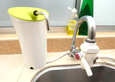 a kitchen sink with a faucet and a cup at Decozy 3.0 Semi-D in Ipoh