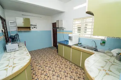 a kitchen with two beds and a sink in it at GLYSM Tambun Stay 
