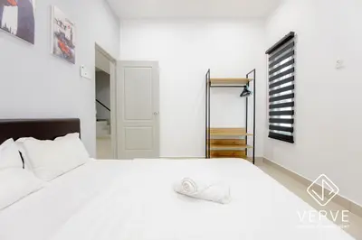a white bedroom with a large white bed at Ipoh Luxury Suites by Verve (18 Pax) EECH16 in Ipoh