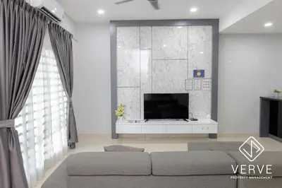 a living room with a couch and a tv at Ipoh Luxury Suites by Verve (18 Pax) EECH16 in Ipoh