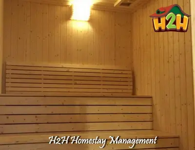 a sauna with stairs and a sign on the wall at H2H - Eleven14 Majestic Ipoh in Ipoh