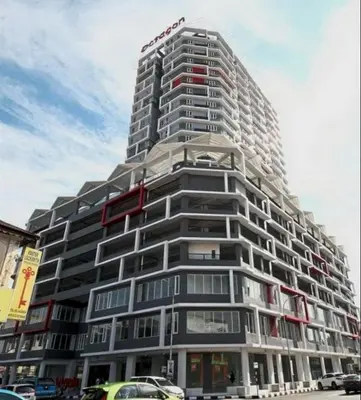 a tall building with a sign on top of it at H2H - Sweet Cottage - Octagon in Ipoh