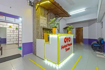 a lobby of a building with an oyo private practice room at Hotel O Purple Town in Sekincan