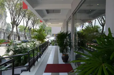 a hallway with plants on the side of a building at Hotel Eastana Ipoh in Ipoh
