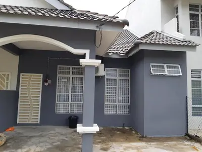 a blue and white house with a door at Anis Homestay Gua Musang in Gua Musang
