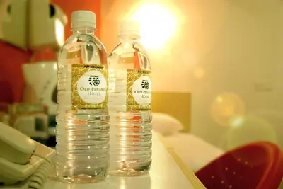 two bottles of water sitting on top of a table at Old Penang Hotel - Penang Times Square in George Town