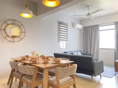 a dining room with a table and chairs at Arcadia Penang by Plush in George Town