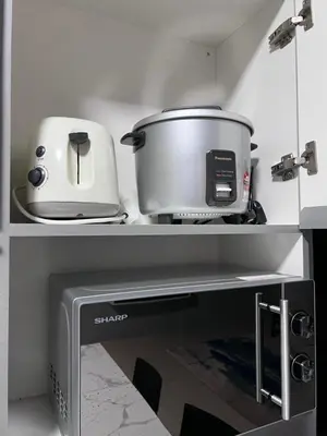 a kitchen with a counter with two pots and a toaster at Casahome by Irdina Meru- 8pax -10pax in Ipoh