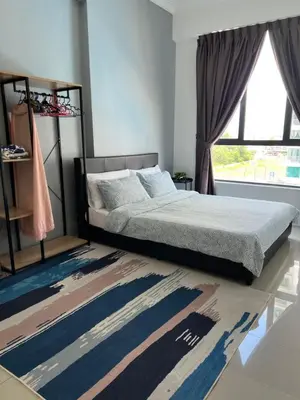 a bedroom with a bed and a window and a rug at Casahome by Irdina Meru- 8pax -10pax in Ipoh