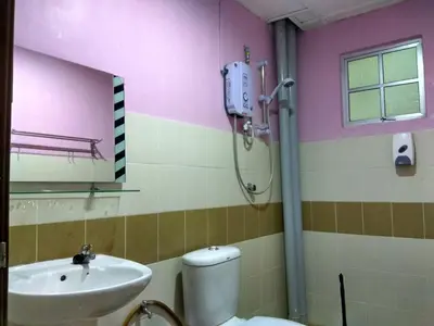 a bathroom with a toilet and a sink at Tenang & Tranquil Homestay - B605 Cameron Highlands in Brinchang