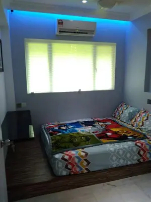 a bedroom with a bed in a room with a window at Fastbook Majestic Home 10pax in Ayer Itam