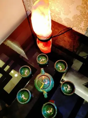 a table with a group of glasses and a candle at Fastbook Majestic Home 10pax in Ayer Itam