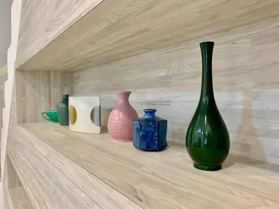 a shelf with four vases sitting on it at BRAND NEW Cosy Minimalist Home in Butterworth