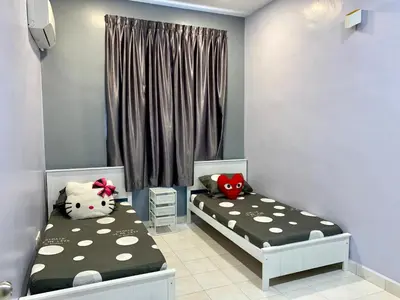 two twin beds in a room with a window at BRAND NEW Cosy Minimalist Home in Butterworth