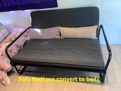 a bench with two pillows on it in a room at Yellow Cube at Lumut Cube Homestay Kontena in Lumut