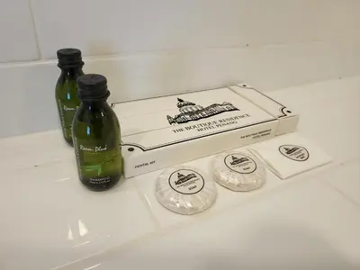 two bottles and a box on top of a counter at The Boutique Residence Hotel in George Town