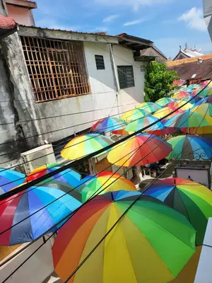 a bunch of colorful umbrellas in front of a building at The Boutique Residence Hotel in George Town
