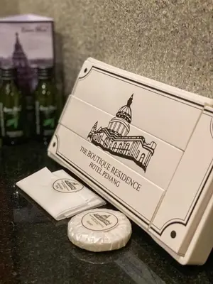a box sitting on a table with bottles of wine at The Boutique Residence Hotel in George Town