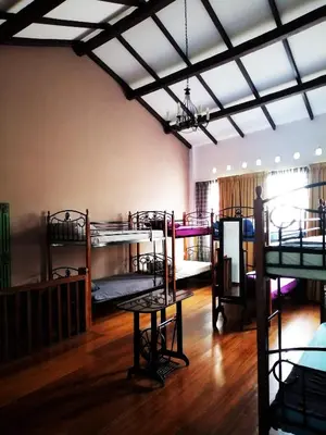 a room with three bunk beds in it at Great Shanghai Guesthouse in George Town