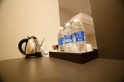 a group of bottles of water sitting on a table at Art Cottage Hotel in Ipoh