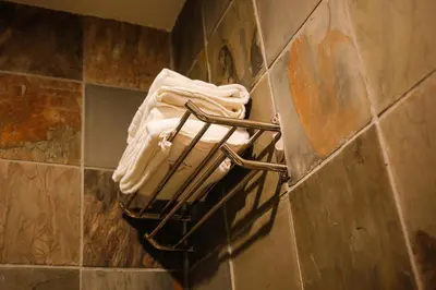 a towel rack on a wall in a bathroom at Art Cottage Hotel in Ipoh