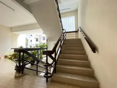a staircase in a building with a stair case at Hotel O Wg Guest House in George Town