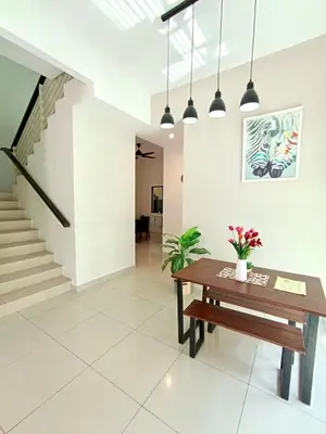 a living room with a bench and stairs at TROPICAL LIVINGS MERU IPOH HOMESTAY by Grab A Stay in Ipoh