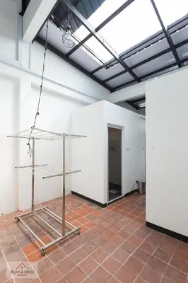 a metal shelf in a room with a white wall at Rumahku Express, Georgetown, Penang in George Town