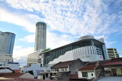 a city with tall buildings and a cloudy sky at Rumahku Express, Georgetown, Penang in George Town