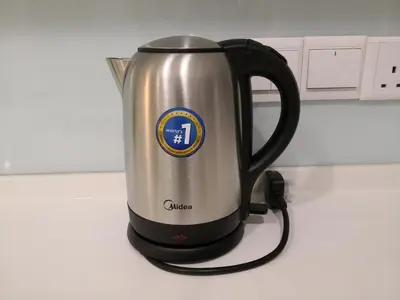 a coffee kettle is sitting on a kitchen counter at Strait Garden Suites X Ace Pro @ George Town in Jelutong