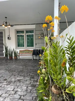 a patio with a bunch of plants and a couch at Premium Garden Home 17 Golden Hills in Brinchang