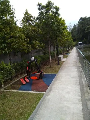 a playground in a park next to a sidewalk at Premium Garden Home 17 Golden Hills in Brinchang