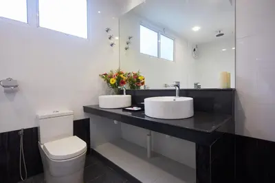 a bathroom with a sink and a toilet at Ahn-Yi Residence in Brinchang