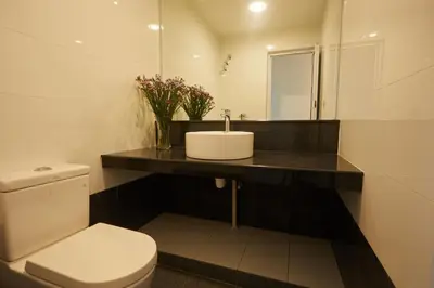 a bathroom with a sink and a toilet at Ahn-Yi Residence in Brinchang
