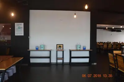 a dining room with two tables and chairs at Hotel Seri Malaysia Sungai Petani in Sungai Petani