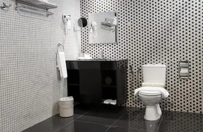 a bathroom with a white toilet and a sink at Strawberry Park Resort in Cameron Highlands